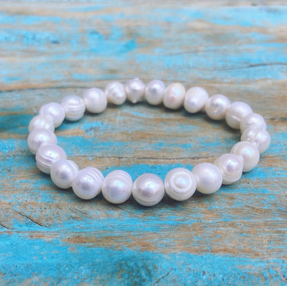 Armband witte potato parels "Moeiteloze Kracht"