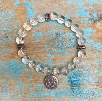 Bergkristal armband met Om-bedel "Zuiver in je kracht"
