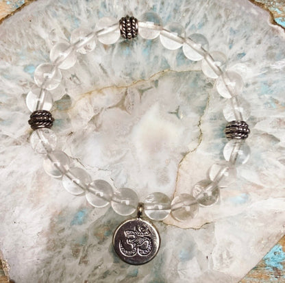 Bergkristal armband met Om-bedel "Zuiver in je kracht"