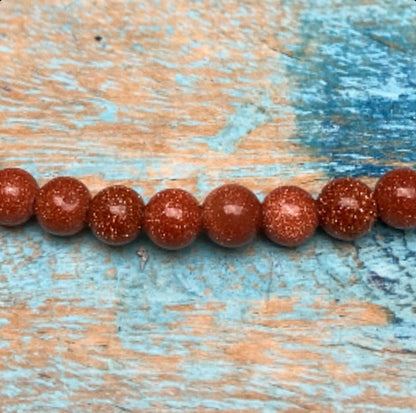 Rode Goudsteen armband "Het vuur in jezelf"