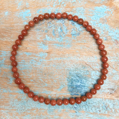 Rode Goudsteen armband "Het vuur in jezelf"